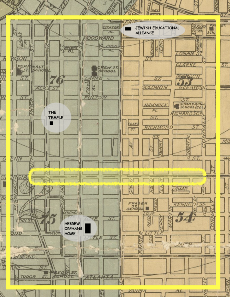 Map delineated by yellow square with three buildings circled and labeled, two on the left (green) half of the square and one at the top of the right (yello) half.