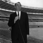 black and white image of a WSB radio reporter at the Atlanta-Fulton County stadium