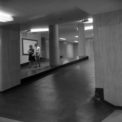 Students inside Kell Hall walking down the converted parking garage ramps at Georgia State University, 1964