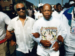 Representative John Lewis with Representative Tyrone Brooks arm-in-arm at the Brothers Day March, 1992