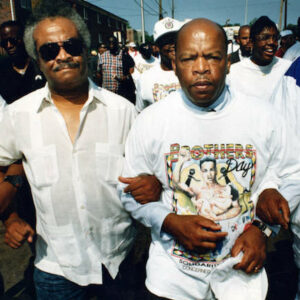 Representative John Lewis with Representative Tyrone Brooks arm-in-arm at the Brothers Day March, 1992